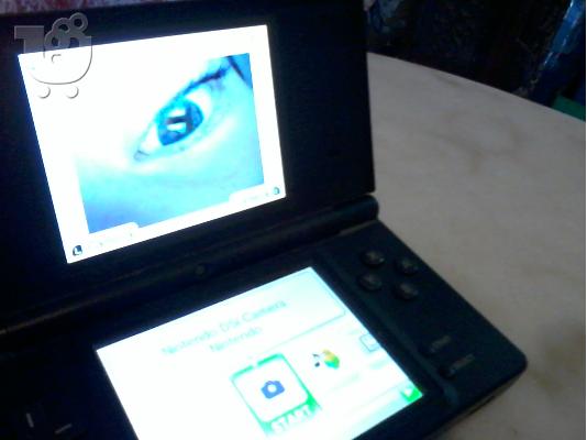 Nintendo Dsi with:Case,3 action replay,16 cards,6 card case in 150 EURW FREEEE